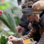 two-women-light-a-candle-at-a-memorial-for-the-victims-of-the-deadly-attacks-in-front-of-the-synagogue-in-krystalgade-in-copenhagen_5213599