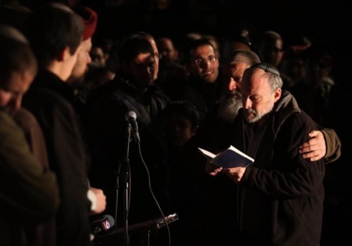 (David Gelman recites the 'Kaddish' at the funeral for his son Eliav, Credit: Marc Israel Sellem)