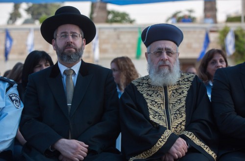 Chief Sephardi Rabbi Yitzhak Yosef and Ashkenazi Chief Rabbi David Lau (L) attend a New Year's ceremony of the Israel Police Command at the National Headquarters of the Israel Police in Jerusalem on September 7, 2015. Photo by Yonatan Sindel/Flash90
