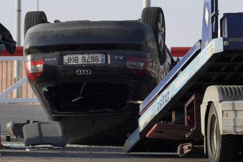 A car involved in a terrorist attack is seen in Cambrils, a city 120 kilometres south of Barcelona, on August 18, 2017. Drivers have ploughed on August 17, 2017 into pedestrians in two quick-succession, separate attacks in Barcelona and another popular Spanish seaside city, leaving 13 people dead and injuring more than 100 others. In the first incident, which was claimed by the Islamic State group, a white van sped into a street packed full of tourists in central Barcelona on Thursday afternoon, knocking people out of the way and killing 13 in a scene of chaos and horror. Some eight hours later in Cambrils, a city 120 kilometres south of Barcelona, an Audi A3 car rammed into pedestrians, injuring six civilians -- one of them critical -- and a police officer, authorities said. / AFP PHOTO / LLUIS GENE