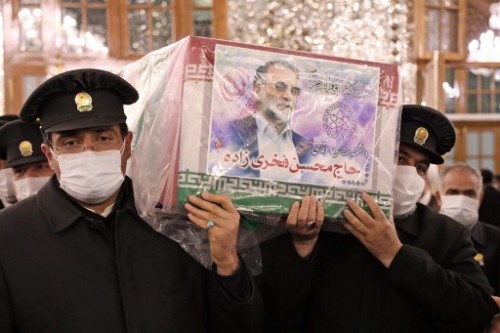 A handout picture provided by Iran's Defence Ministry on November 29, 2020 shows Servants of the holy shrine of Imam Reza carrying the coffin of Iran's assassinated top nuclear scientist Mohsen Fakhrizadeh during his funeral procession in the northeastern city of Mashhad. - The body of Iran's assassinated top nuclear scientist has been taken to the first of several revered Shiite Muslim shrines ahead of his burial set for November 30, state media reported. The killing of Fakhrizadeh -- whom Israel has dubbed the "father" of Iran's nuclear programme -- has once more heightened tensions between the Islamic republic and its foes. (Photo by - / IRANIAN DEFENCE MINISTRY / AFP) / ==  RESTRICTED TO EDITORIAL USE - MANDATORY CREDIT "AFP PHOTO / HO /IRANIAN DEFENCE MINISTRY" - NO MARKETING NO ADVERTISING CAMPAIGNS - DISTRIBUTED AS A SERVICE TO CLIENTS ==