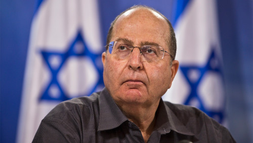 Israeli Defence Minister Moshe Yaalon attends a news conference in Tel Aviv July 28, 2014. Palestinian fighters slipped into an Israeli village from the Gaza Strip and fought a gun battle with troops on Monday as an unofficial truce called for the Muslim Eid al-Fitr festival disintegrated. The incident was not the only breach of the fragile truce. Eight children and two adults were killed by a blast at a park in northern Gaza and four Israelis were reported to have been killed by cross-border Palestinian mortar fire. REUTERS/Nir Elias (ISRAEL - Tags: POLITICS CIVIL UNREST MILITARY) - RTR40FNH