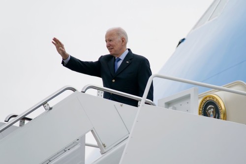 President Joe Biden waves as he boards Air Force One at Andrews Air Force Base, Md., Wednesday, March 23, 2022. Biden is traveling to Europe to meet with World counterparts on Russia's invasion of Ukraine. (AP Photo/Evan Vucci)