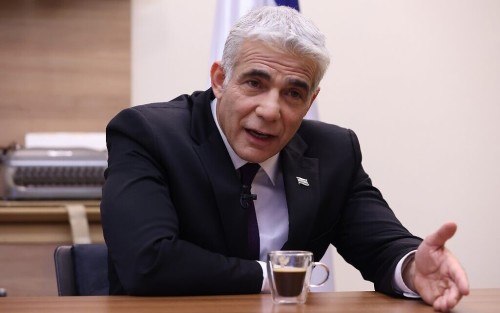 Israel's opposition leader Yair Lapid is pictured during an interview with Agence France-Presse (AFP)at his office in the Knesset, Israel's parliament, in Jerusalem, on September 14, 2020. - Israeli Prime Minister Benjamin Netanyahu has "no intention" of discussing peace with the Palestinians, Lapid told AFP ahead of the signing of landmark deals with the UAE and Bahrain. (Photo by Emmanuel DUNAND / AFP)