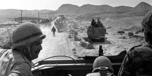 File - In this June 7, 1967 file photo, Israeli troops advance through Sinai, Egypt during the Six-Day War. It may well be remembered as a pyrrhic victory for Israel: a six-day war in which it vanquished several Arab armies, only to be saddled with a 50-year fight with the Palestinians for the Holy Land. A half century after the watershed 1967 Mideast war, many in Israel think the lighting victory planted the seeds of doom. (AP Photo, File)