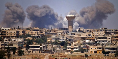 (FILES) In this file photo taken on July 5, 2018 smoke rises above rebel-held areas of the city of Daraa during reported airstrikes by Syrian regime forces. - Thirteen combatants and three civilians were killed on July 29, 2021 in Syria's southern province of Daraa during the fiercest clashes there since the area came under regime control, a war monitor said. Russian-backed Syrian army and allied forces recaptured Daraa from rebels in 2018, a symbolic blow to the anti-government uprising born there in 2011. (Photo by - / AFP)
