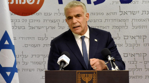 Israel's centrist opposition leader Yair Lapid delivers a statement to the press at the Knesset (Israeli parliament) in Jerusalem on May 31, 2021. - Lapid said "many obstacles" remain before a diverse coalition to oust long-serving right-wing Prime Minister Benjamin Netanyahu can be agreed. (Photo by DEBBIE HILL / POOL / AFP)