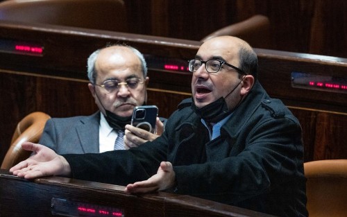 MK's Sami Abu Shehadeh and Ahmad Tibi seen during a plenum session in the assembly hall of the Israeli parliament in Jerusalem, February 23, 2022. Photo by Yonatan Sindel/Flash90 *** Local Caption *** הצבעה כנסת מליאה חברי כנסת סאמי אבו שחאדה אחמד טיבי