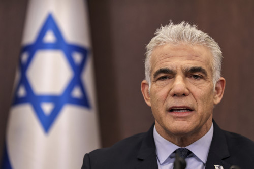 Israel's caretaker Prime Minister Yair Lapid attends the weekly cabinet meeting in Jerusalem, on Sunday, Sept. 18, 2022. (Ronaldo Schemidt/Pool Photo via AP)