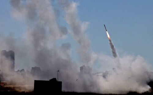 Israel's Iron Dome aerial defence system is activated to intercept a rocket launched from the Gaza Strip, controlled by the Palestinian Hamas movement, above the southern Israeli city of Ashdod, on May 12, 2021. (Photo by EMMANUEL DUNAND / AFP)