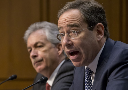 The Senate Foreign Relations Committee holds a hearing with Deputy Secretary of State Thomas Nides, right, who is in charge of management, and Deputy Secretary of State William Burns,left, who is in charge of policy, after an independent review panel said this week that serious bureaucratic mismanagement was responsible for inadequate security at the mission in Benghazi, Libya, where the U.S. ambassador and three other Americans were killed on Sept. 11, on Capitol Hill in Washington, Thursday, Dec. 20, 2012. Secretary of State Hillary Rodham Clinton had been scheduled to testify but canceled after fainting and sustaining a concussion last week.  (AP Photo/J. Scott Applewhite)