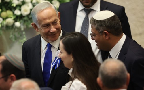 Israel's Likud Party leader Benjamin Netanyahu arrives during the swearing-in ceremony for Israeli lawmakers at the Knesset, Israel's parliament, in Jerusalem, Tuesday, Nov. 15, 2022. Israeli lawmakers were sworn in at the Knesset, on Tuesday, following national elections earlier this month.  (Abir Sultan/Pool Photo via AP)