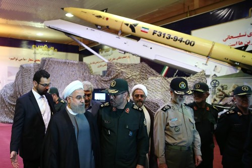 A handout picture released by the official website of the Iranian President Hassan Rouhani shows him (2nd L) and Defence Minister Hossein Dehghan (C) during the Defence Industry Day ceremony to unveil the country's latest domestically produced surface-to-surface Fateh (Winner) 313 missile on August 22, 2015 in Tehran. The Fateh (Winner) 313 missile has a 500-kilometre (300 miles) range and features more advanced sensors and technology than earlier missiles, according to Sepah News, the website of Iran's powerful Revolutionary Guards. AFP PHOTO / HO / IRANIAN PRESIDENCY WEBSITE == RESTRICTED TO EDITORIAL USE - MANDATORY CREDIT "AFP PHOTO / HO / IRANIAN PRESIDENCY WEBSITE" - NO MARKETING NO ADVERTISING CAMPAIGNS - DISTRIBUTED AS A SERVICE TO CLIENTS ==