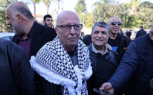 Arab Israeli Karim Younes is welcomed by friends and relatives following his release after 40 years in an Israeli prison for kidnapping and murdering an Israeli soldier, on January 5, 2023, in the norther Israeli town of Arara. (Photo by AHMAD GHARABLI / AFP)