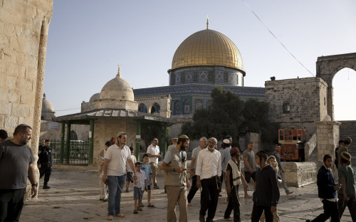 Jews visit the Temple Mount, known to Muslims as the Noble Sanctuary, on the Al-Aqsa Mosque compound in the Old City of Jerusalem, on the morning before Rosh Hashana, the Jewish New Year, which begins at sundown, Sunday, Sept. 25, 2022. (AP Photo/ Maya Alleruzzo)