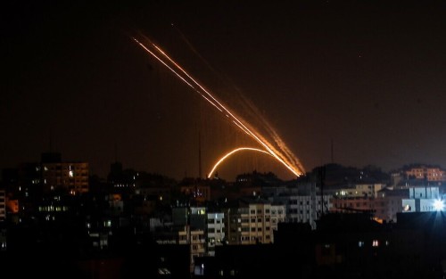 Rockets are fired from the Gaza Strip toward Israel on November 13, 2019. - Exchanges of fire triggered by Israel's targeted killing of a top militant in Gaza raged for a second day today and showed little sign of easing as the Palestinian death toll surged to 23. (Photo by Anas BABA / AFP)