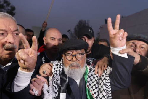 83-year-old Palestinian prisoner Fuad Shubaki visits the tomb of late Palestinian leader Yasser Arafat in the West Bank city of Ramallah on March 13, 2023, after being released from an Israeli jail after serving a 17-year sentence. The oldest Palestinian prisoner in an Israeli jail was released on Monday after serving a 17-year sentence for arms smuggling, an advocacy group and his son said. (Photo by AHMAD GHARABLI / AFP)