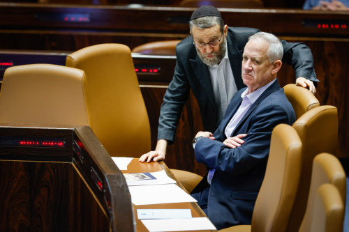 Minister of Defense Benny Gantz speaks with MK Moshe Gafni at the Israeli parliament during a plenum session in the assembly hall of the Israeli parliament, in Jerusalem, on June 1, 2022. Photo by Olivier Fitoussi/Flash90 *** Local Caption *** îìéàä îùä âôðé ëðñú áðé âðõ ùø äáéèçåï