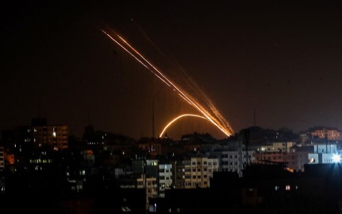 Rockets are fired from the Gaza Strip toward Israel on November 13, 2019. - Exchanges of fire triggered by Israel's targeted killing of a top militant in Gaza raged for a second day today and showed little sign of easing as the Palestinian death toll surged to 23. (Photo by Anas BABA / AFP)