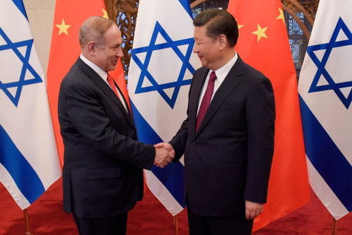 BEIJING, CHINA - MARCH 21:  Chinese President Xi Jinping (R) and Israeli Prime Minister Benjamin Netanyahu (L) shake hands ahead of their talks at Diaoyutai State Guesthouse on March 21, 2017 in Beijing, China.  (Photo by Etienne Oliveau/Pool/Getty Images)