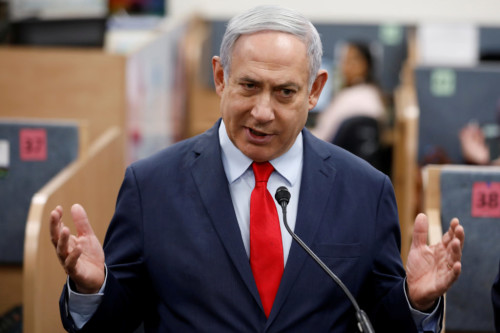 FILE PHOTO: Israeli Prime Minister Benjamin Netanyahu gestures as he delivers a statement during his visit at the Health Ministry national hotline, in Kiryat Malachi, Israel March 1, 2020. REUTERS/Amir Cohen/File Photo