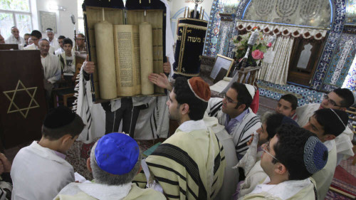 Iranian Jews attend a Shabbat service at the Pol-e-Choubi Synagogue in Tehran on April 23. Iran has the largest Jewish population in the Middle East outside Israel. Growing conflict between the two countries is affecting Iranian Jews in both places.