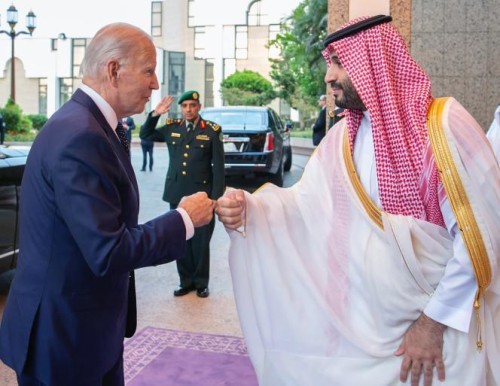 In this image released by the Saudi Royal Palace, Saudi Crown Prince Mohammed bin Salman, right, greets President Joe Biden with a fist bump after his arrival in Jeddah, Saudi Arabia, Friday, July 15, 2022. (Bandar Aljaloud/Saudi Royal Palace via AP)