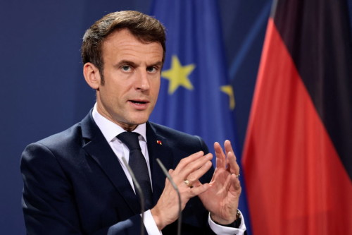 French President Emmanuel Macron speaks to the media ahead of a Weimar Triangle meeting to discuss the ongoing Ukraine crisis, in Berlin, Germany, February 8, 2022. REUTERS/Hannibal Hanschke/Pool