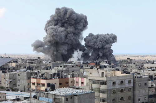 Smoke billows during an Israeli air strike in Rafah in the southern Gaza Strip on October 12, 2023. Thousands of people, both Israeli and Palestinians have died since October 7, 2023, after Palestinian Hamas militants entered Israel in a surprise attack leading Israel to declare war on Hamas in the Gaza Strip enclave on October 8. (Photo by SAID KHATIB / AFP)