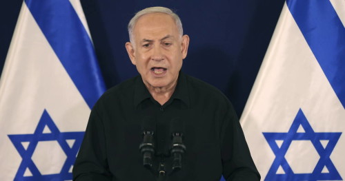 Israeli Prime Minister Benjamin Netanyahu speaks during a press conference with Defense Minister Yoav Gallant and Cabinet Minister Benny Gantz in the Kirya military base in Tel Aviv, Israel, Saturday, Oct. 28, 2023. (Abir Sultan/Pool Photo via AP)