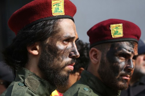 Hezbollah members attend the funeral of their comrades in the southern village of Khirbet Silem on October 10, 2023. Israeli strikes on Lebanon killed three Hezbollah members on October 9, the Iran-backed group said, as tensions surged after Palestinian militants tried to infiltrate into Israel from Lebanon. (Photo by Mahmoud ZAYYAT / AFP)