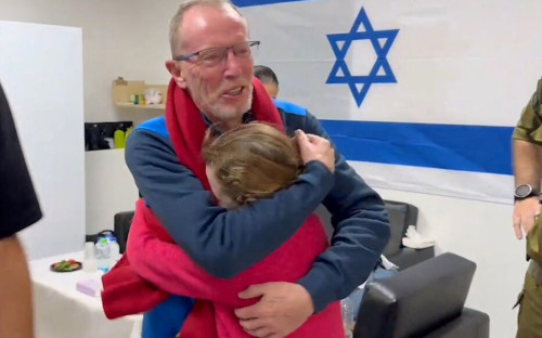 Irish-Israeli girl Emily Hand, who was abducted by Hamas gunmen during the October 7 attack on Israel, meets her father Thomas Hand after being released as part of a hostages-prisoners swap deal between Hamas and Israel amid a temporary truce, at an unknown location in Israel, in this screengrab from a handout video released November 26, 2023. Israel Defense Forces/Handout via REUTERS THIS IMAGE HAS BEEN SUPPLIED BY A THIRD PARTY.