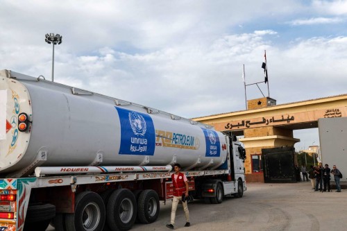 A truck of the United Nations Relief and Works Agency for Palestine Refugees (UNRWA) carrying fuel arrives at the Egyptian side of the Rafah border crossing with the Gaza Strip on November 22, 2023, amid ongoing battles between Israel and the Palestinian militant group Hamas.  (Photo by Khaled DESOUKI / AFP)