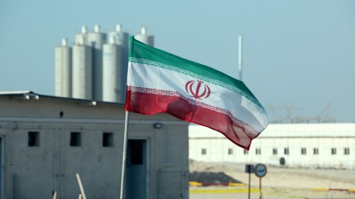 A picture taken on November 10, 2019, shows an Iranian flag in Iran's Bushehr nuclear power plant, during an official ceremony to kick-start works on a second reactor at the facility. - Bushehr is Iran's only nuclear power station and is currently running on imported fuel from Russia that is closely monitored by the UN's International Atomic Energy Agency. (Photo by ATTA KENARE / AFP)