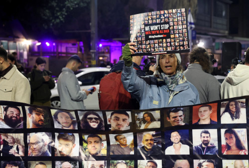 A person holds a placard, as families of hostages and supporters protest to call for the immediate release of hostages kidnapped during the deadly October 7 attack by Palestinian Islamist group Hamas, outside Israeli Prime Minister Benjamin Netanyahu residence, in Jerusalem January 21, 2024. REUTERS/Ronen Zvulun