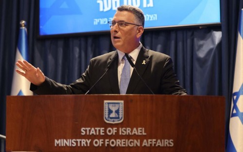 Israel's new Foreign Minister Gideon Saar speaks during a hand over ceremony at the Ministry of Foreign Affairs in Jerusalem on November 10, 2024. Israel's outgoing Foreign Minister Israel Katz , succeeded by Saar, was sworn in as Israel's new defence minister before parliament on November 7, after his predecessor's shock dismissal by the prime minister over a breakdown in trust during the war in Gaza. (Photo by Menahem KAHANA / AFP)