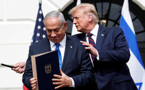 FILE PHOTO: Israel's Prime Minister Benjamin Netanyahu stands with U.S. President Donald Trump after signing the Abraham Accords, normalizing relations between Israel and some of its Middle East neighbors, on the South Lawn of the White House in Washington, U.S., September 15, 2020. REUTERS/Tom Brenner/File Photo